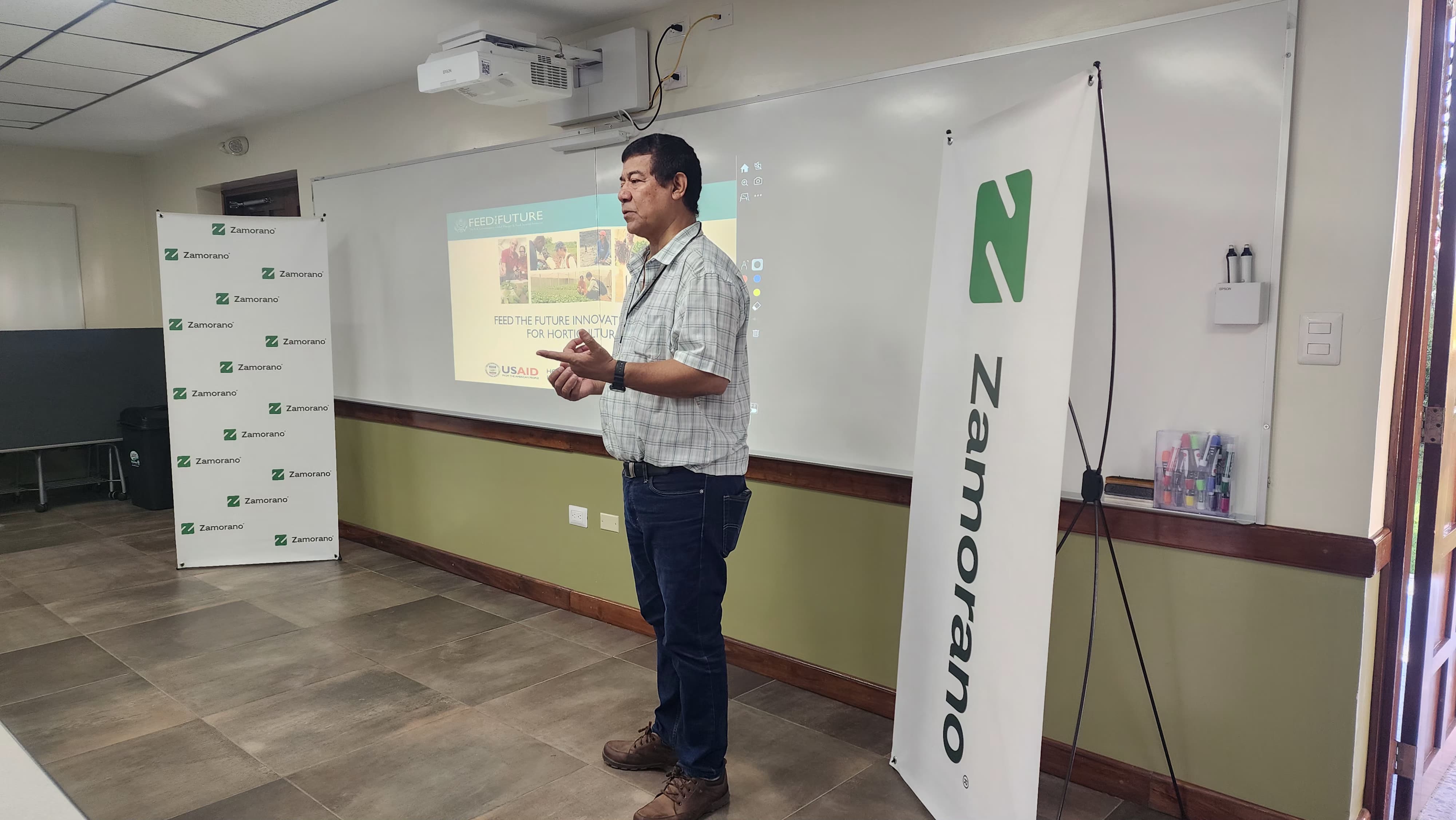 Professor Julio López Montes, Msc., delivers information about the Feed the Future Innovation Lab for Horticulture program postharvest technologies and innovations during a classroom training session.