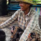 Cambodian pig farmer with sow